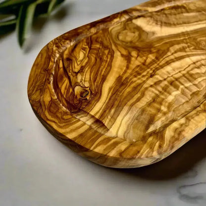 Olivenholz Schneidebrett mit Saftrille & Grifflasche